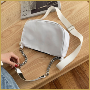 Nylon sling bag for women with chic design and chain strap.